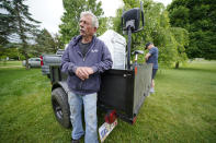 Dale Smith, left, pauses as he moves out of his home of 30 years on the future site of a $20 billion Intel processor plant on Thursday, June 9, 2022. Intel announced the Ohio development in January, part of the company's efforts to alleviate a global shortage of chips powering everything from phones to cars to home appliances. It’s the largest economic development investment in Ohio history. (AP Photo/Gene J. Puskar)