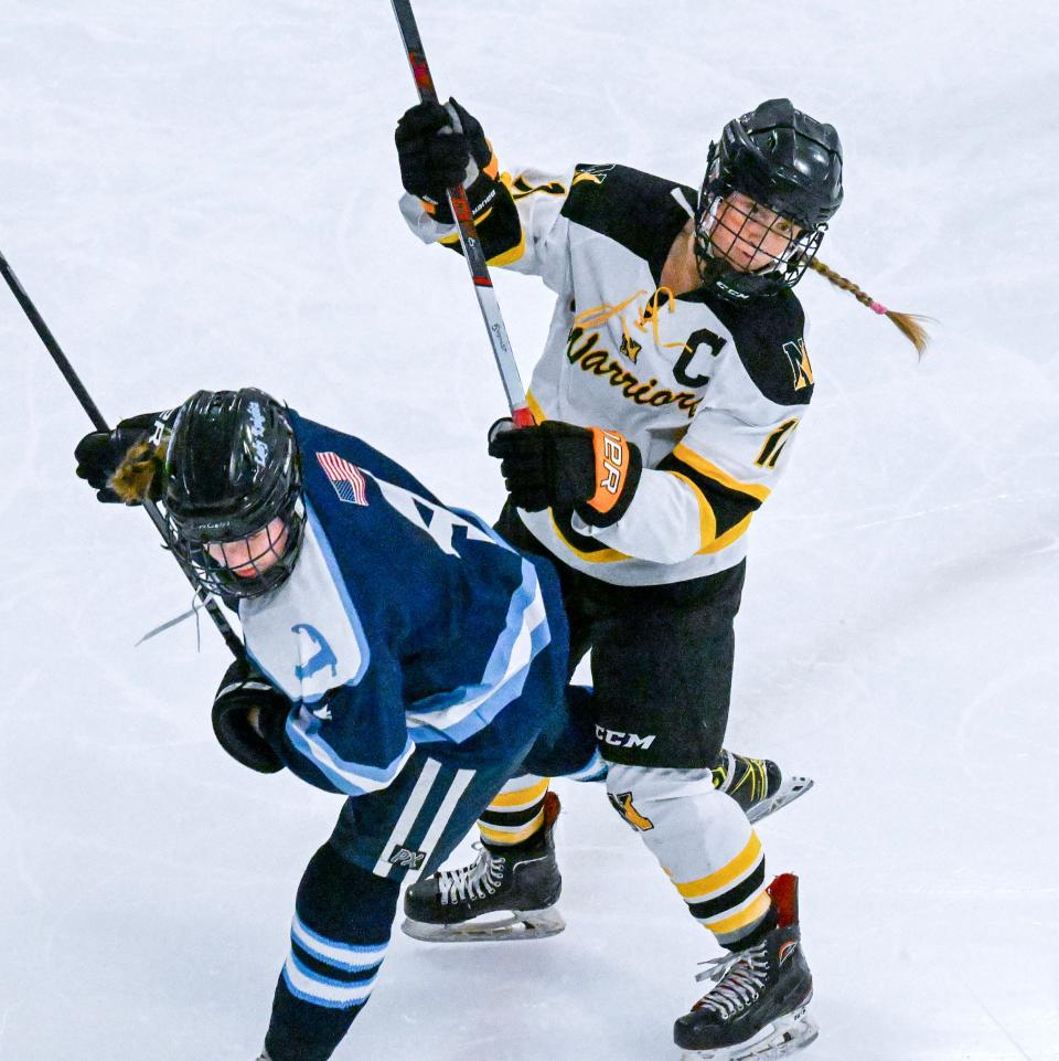 Marley Dwyer of Sandwich and Sienna Reeves of Nauset tangle.