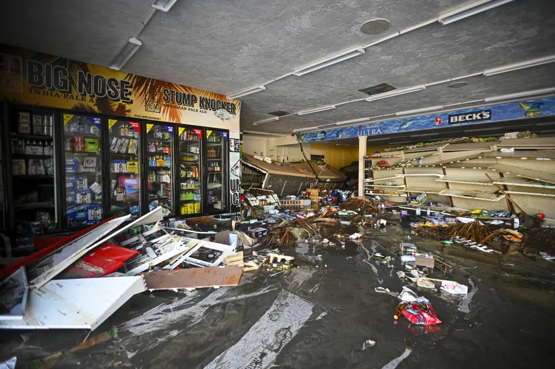 Debris inside a flooded store after Hurricane Helene made landfall in Cedar Key, Fla.