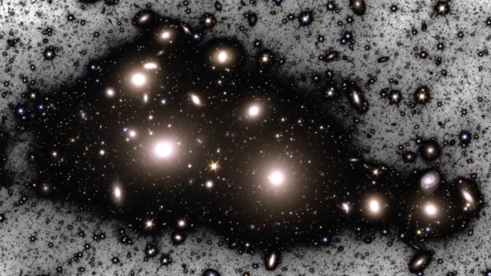 A manipulated image of the Perseus cluster showing the two brightest galaxies  brightest galaxies in the cluster, NGC 1275 (left) and NGC 1272 (right),