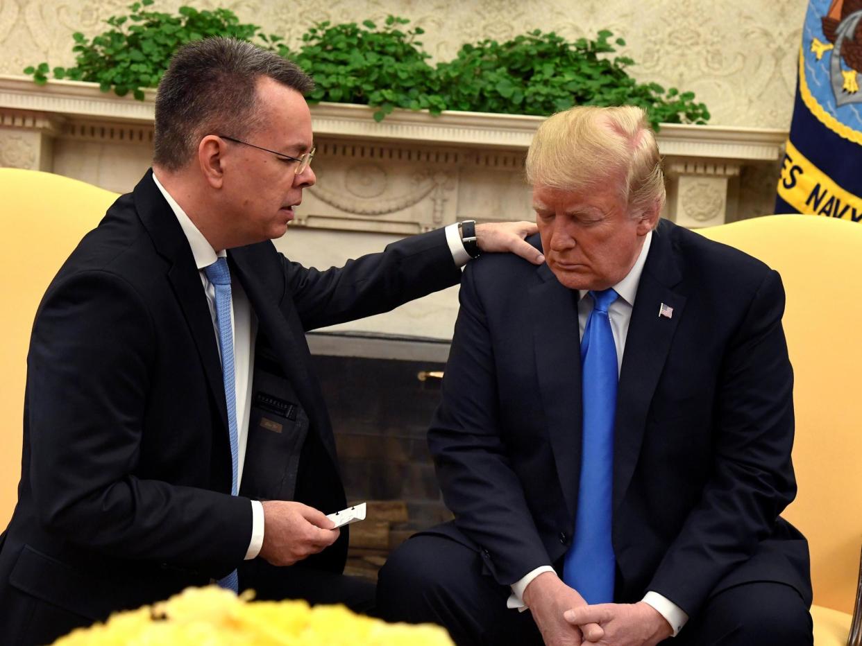 Mr Brunson knelt and prayed for Mr Trump in the Oval Office: REUTERS