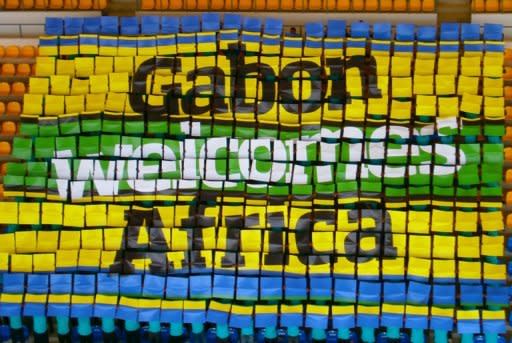 People hold up placards in a stadium in Gabon's capital Libreville to form a welcoming message for the Africa Cup of Nations 2012 (CAN 2012), in a picture taken on January 4 and released by the Africa Cup of Nations 2012 press office via Havas Sport. The CAN 2012 will take place in Equatorial Guinea and Gabon from January 21 until February 12