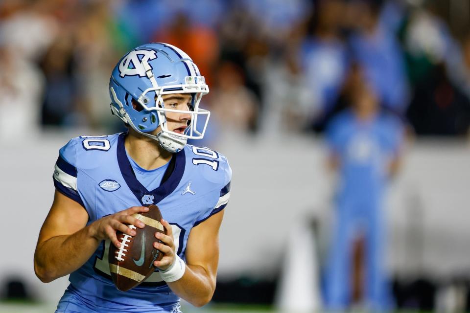 Oct 14, 2023; Chapel Hill, North Carolina, USA; North Carolina Tar Heels quarterback Drake Maye (10) looks to pass against the Miami Hurricanes in the first half at Kenan Memorial Stadium. Mandatory Credit: Nell Redmond-USA TODAY Sports