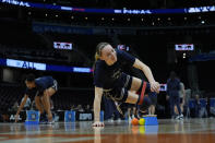 UConn's Paige Bueckers stretches during a practice for an NCAA Women's Final Four semifinals basketball game Thursday, April 4, 2024, in Cleveland. (AP Photo/Carolyn Kaster)