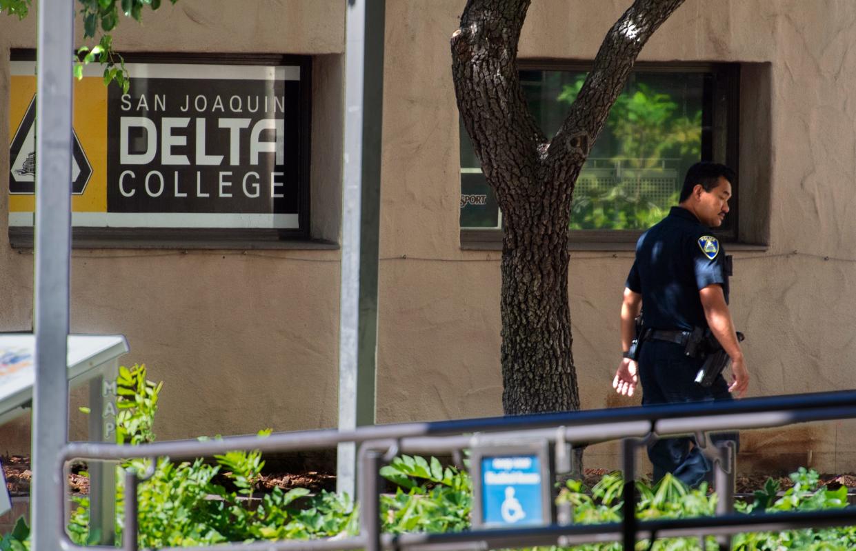 A San Joaquin Delta College Police Department officer patrols the campus after bomb threat was made against the college Wednesday.