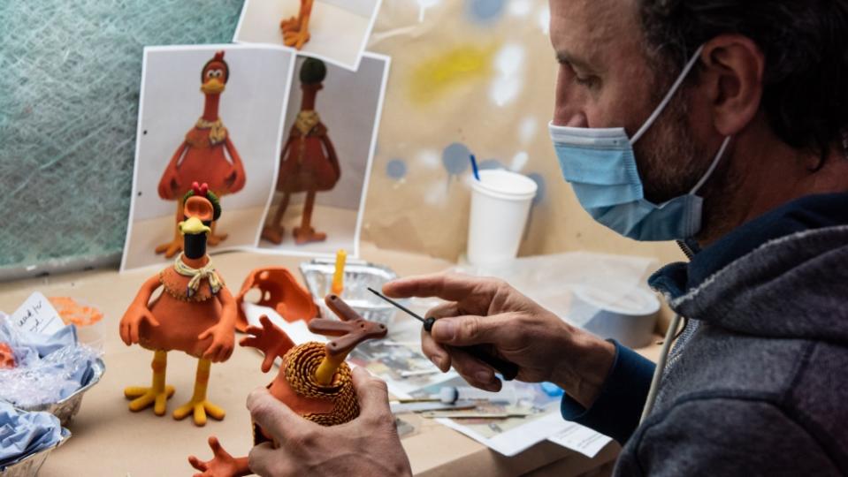 A puppet maker at Aardman working on “Chicken Run: Dawn of the Nugget” (Courtesy of Netflix)