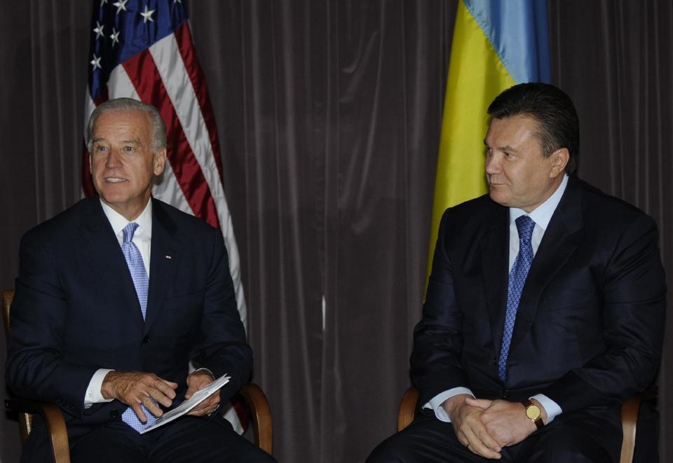 FILE - this July 21, 2009 file photo shows Vice President Joe Biden meeting with Viktor Yanukovych, the then-Moscow-backed presidential candidate in Kiev, Ukraine. In the hours before he fled Ukraine's capital, Yanukovych huddled on the phone with Biden, a longtime associate and close contact throughout the political crisis that gripped the former Soviet republic. Biden and Yanukovych held nine lengthy phone calls during the crisis, building up a level of trust the US officials say was crucial to getting the Ukraine leader to sign an agreement that way for a fragile peace.(AP Photo/Sergei Chuzavkov, File)