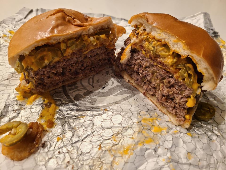 wendys bacon jalepeno triple cheeseburger on white wrapper