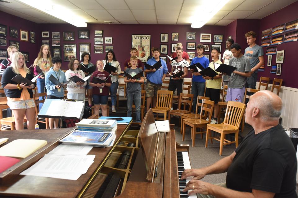 Choir director Rolf Olson leads the Freeman Academy choir during a rehearsal at the Freeman Academy in Freeman, South Dakota on Friday, Aug. 25, 2023.