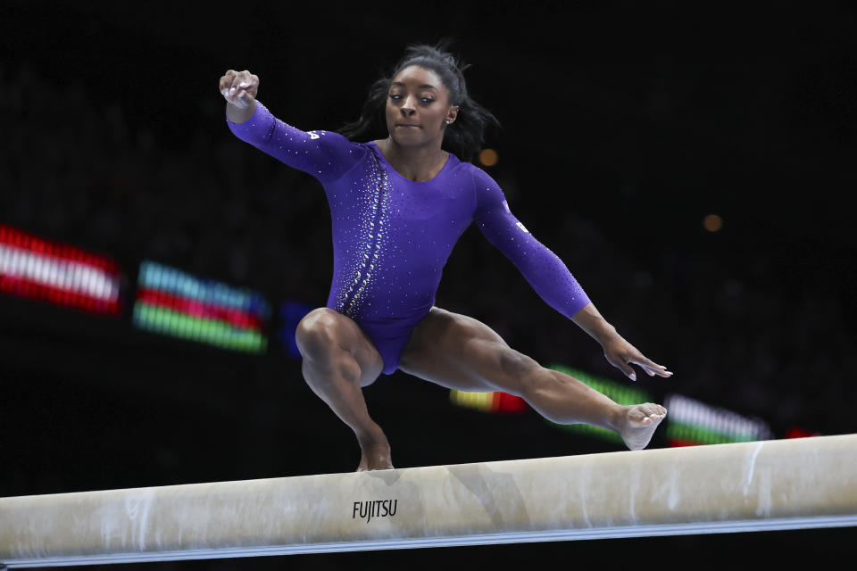 United States' Simone Biles competes on the beam during the apparatus finals at the Artistic Gymnastics World Championships in Antwerp, Belgium, Sunday, Oct. 8, 2023. (AP Photo/Geert vanden Wijngaert)