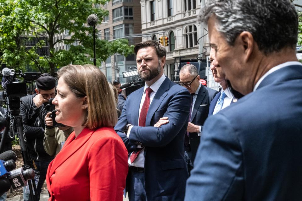 Iowa Attorney General Brenna Bird addresses the media during a break in former U.S. President Donald Trump's criminal trial on Monday, May 13, 2024, in New York City. Sen. J.D. Vance (R-Ohio), center, spoke before Bird with other elected officials supporting Trump.