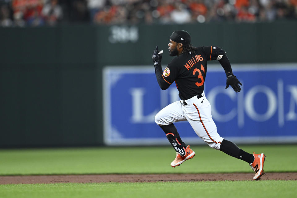 Baltimore Orioles' Cedric Mullins races to third on a triple against the Pittsburgh Pirates during the fifth inning of a baseball game Friday, May 12, 2023, in Baltimore. (AP Photo/Gail Burton)