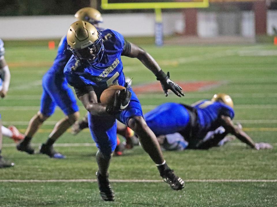 Mainland’s Rodney Hill (5) rushes for a touchdown during the fourth quarter of Friday night’s playoff game against Rockledge, November 17, 2023