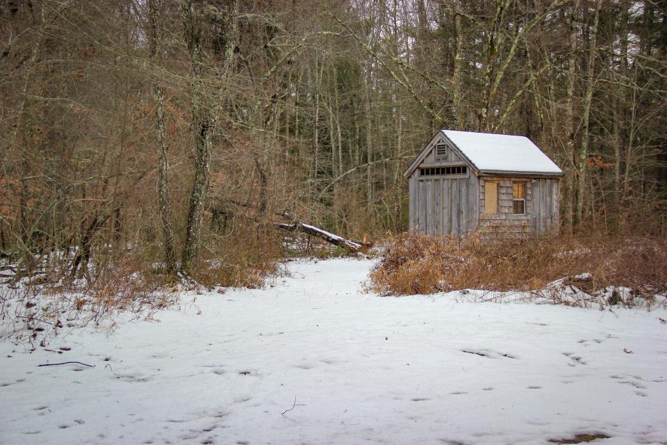 A shed is covered in snow at the Southeastern Massachusetts Bioreserve's Watuppa Reservation parking lot off Blossom Road.