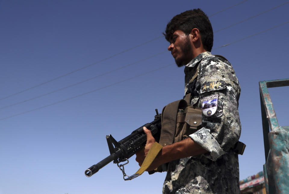 An Afghan policeman stands guard on the outskirts of Mazar-e-Sharif, Afghanistan, Tuesday, Aug. 10, 2021. (AP Photo/Mirwais Bezhan)