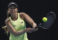 Danielle Collins of the U.S. makes a backhand return to Kazakhstan's Yulia Putintseva during their second round singles match at the Australian Open tennis championship in Melbourne, Australia, Thursday, Jan. 23, 2020. (AP Photo/Andy Wong)