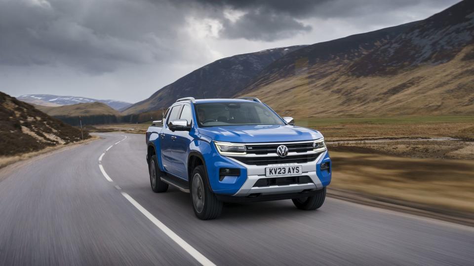 a blue car on a road