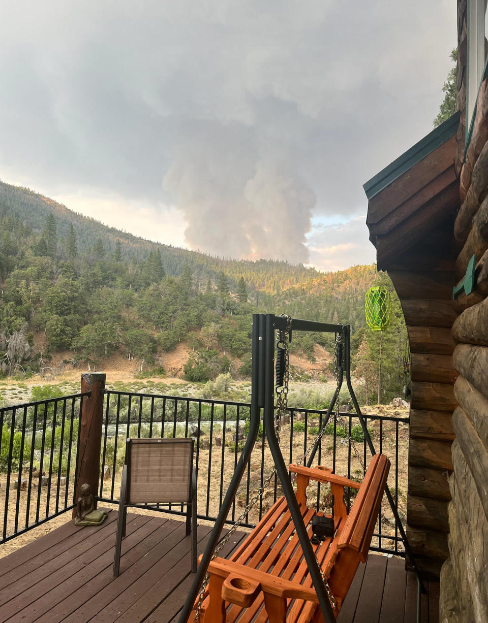 Smoke from the 2023 Main Fire is seen on the deck of Becky Wade and Jeff McCabe. (Courtesy of Becky Wade)