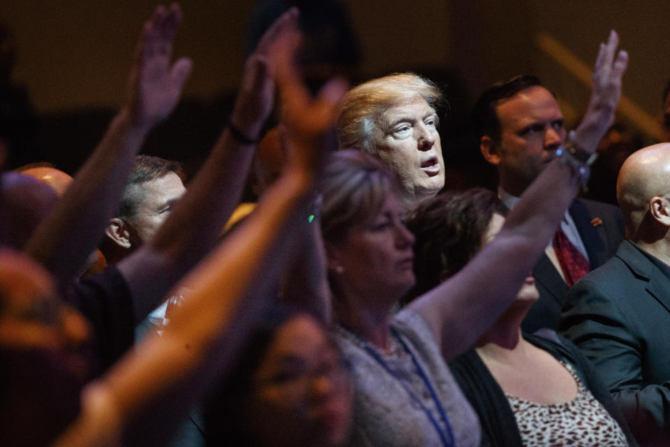 Then-Republican presidential candidate Donald Trump stands during a service at the International Church of Las Vegas in Las Vegas on Oct. 30, 2016. / Credit: Evan Vucci / AP