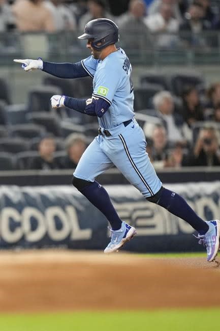 Bo Bichette of the Toronto Blue Jays celebrates his three run