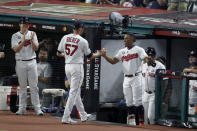 American League pitcher Shane Bieber (57), of the Cleveland Indians, is congratulated by teammate Francisco Lindor, of the Cleveland Indians, after Bieber struck out the side during the fifth inning of the MLB baseball All-Star Game against the National League, Tuesday, July 9, 2019, in Cleveland. (AP Photo/Ron Schwane)