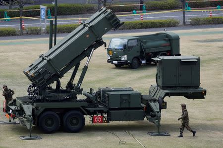 Japan Self-Defence Forces soldiers prepare to refuel a unit of Patriot Advanced Capability-3 (PAC-3) missiles at the Defence Ministry in Tokyo April 10, 2013. REUTERS/Issei Kato/File photo