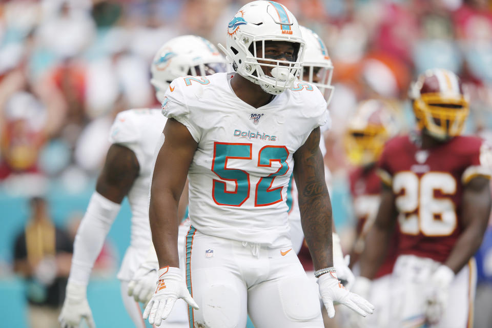 Raekwon McMillan #52 of the Miami Dolphins reacts after a tackle against the Washington Redskins during the first quarter at Hard Rock Stadium on October 13, 2019 in Miami, Florida. (Photo by Michael Reaves/Getty Images)