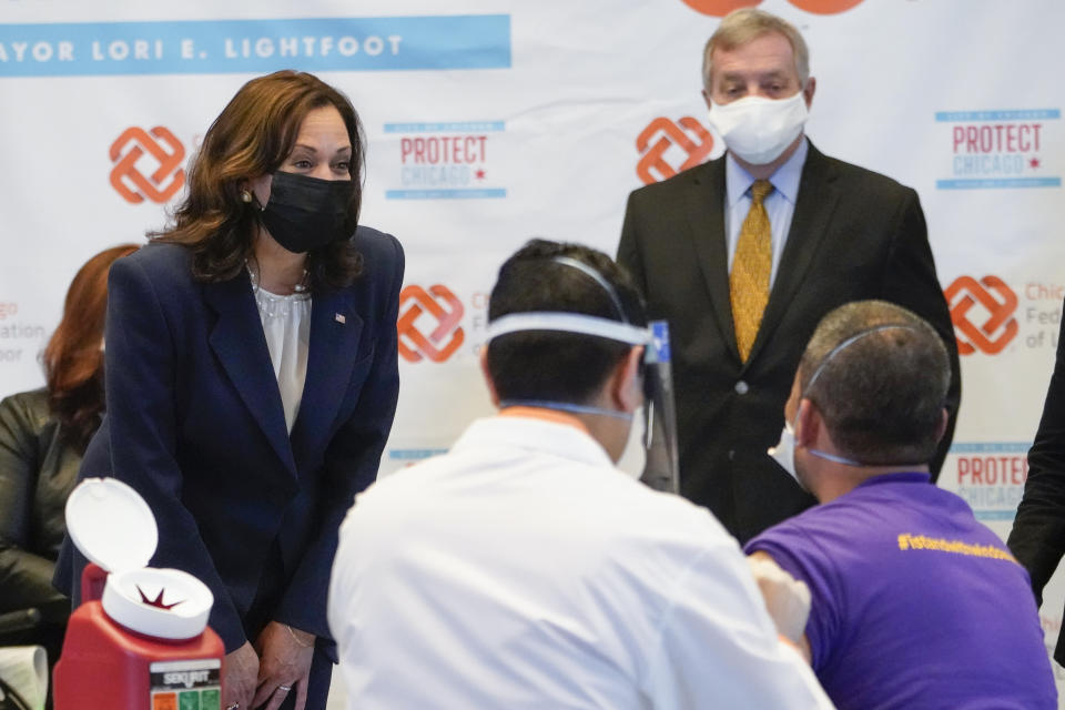 Vice President Kamala Harris talks with Lucio Polanco, a high-rise window washer, as he gets the Johnson & Johnson COVID-19 vaccination from Osman Meah at COVID-19 vaccination site, Tuesday, April 6, 2021, in Chicago. Watching are Sen. Tammy Duckworth, D-Ill., left, and Sen. Dick Durbin, D-Ill. The site is a partnership between the City of Chicago and the Chicago Federation of Labor. (AP Photo/Jacquelyn Martin)