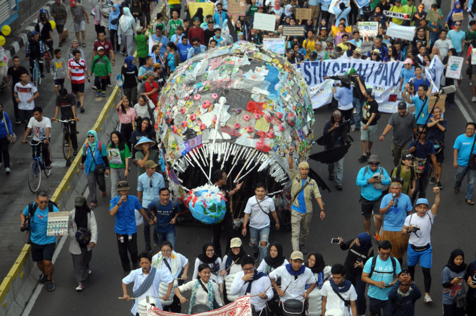 Environmental activists during a demonstration "plastic-free march" on Car-free days in Jakarta, on July, 21,2019. (Photo by Dasril Roszandi/NurPhoto)