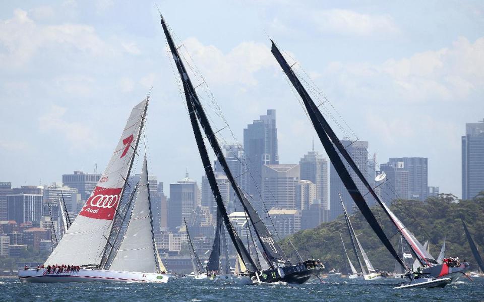 Some of the larger boats maneuver during the start of the Sydney Hobart yacht race in Sydney, Australia, Monday, Dec. 26, 2016. The 88 yachts started in the annual 628-nautical mile race to Australia's island state of Tasmania. (AP Photo/Rick Rycroft)