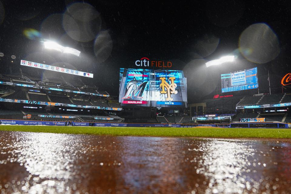 Rain falls during a rain delay of a baseball game between the New York Mets and the Miami Marlins early Friday, Sept. 29, 2023, in New York. (AP Photo/Frank Franklin II)