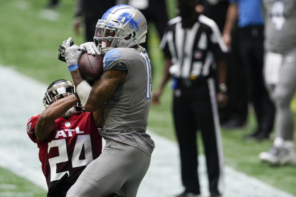 Detroit Lions wide receiver Kenny Golladay (19) makes the catch against Atlanta Falcons cornerback A.J. Terrell (24) during the second half of an NFL football game, Sunday, Oct. 25, 2020, in Atlanta. (AP Photo/John Bazemore)