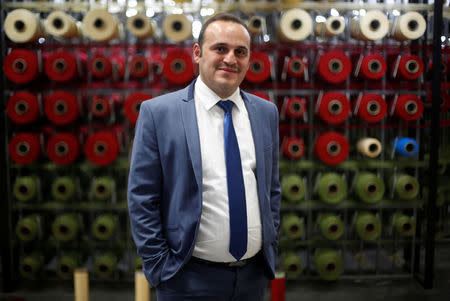 Mahmoud Akkad, a carpet manufacturer, poses at his carpet factory in Jordan Industrial Estates Company in Al-Muwaqar south of Amman, Jordan, September 14, 2017. Picture taken September 14, 2017. REUTERS/Muhammad Hamed