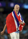 Manchester City's Erling Haaland celebrates at full time after the UEFA Champions League semi-final second leg match against Real Madrid at Etihad Stadium, Manchester. Man City beat Real Madrid 4-0 to advance to Champions League final. (Martin Rickett/PA via AP)