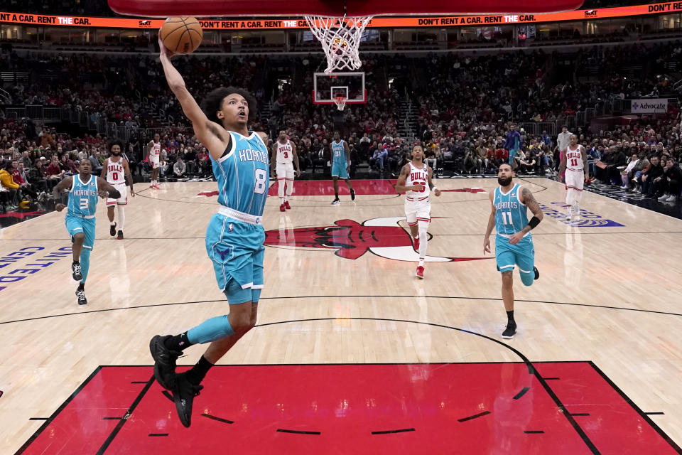 Charlotte Hornets' Nick Smith Jr. goes up for a breakaway dunk during the first half of the team's NBA basketball game against the Chicago Bulls on Friday, Jan. 5, 2024, in Chicago. (AP Photo/Charles Rex Arbogast)