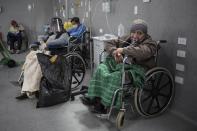 Patients testing positive for the new coronavirus breathe in oxygen in the emergency area of the Guillermo Almenara hospital in Lima, Peru, Friday, May 22, 2020. As more of the poor fall sick, the hospitals that serve them are emerging as some of the most stretched. (AP Photo/Rodrigo Abd)