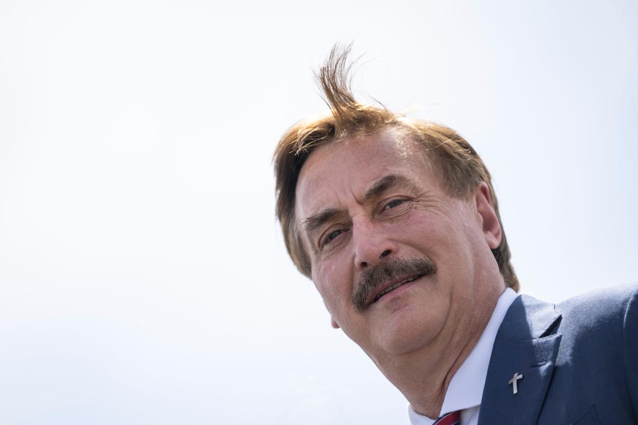 An image of MyPillow CEO Mike Lindell, smiling at the photographer