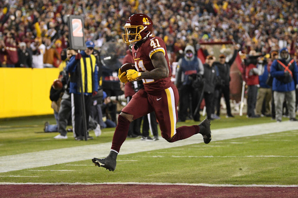 Washington Football Team running back J.D. McKissic (41) runs into the end zone for a touchdown against the Seattle Seahawks during the first half of an NFL football game, Monday, Nov. 29, 2021, in Landover, Md. (AP Photo/Nick Wass)