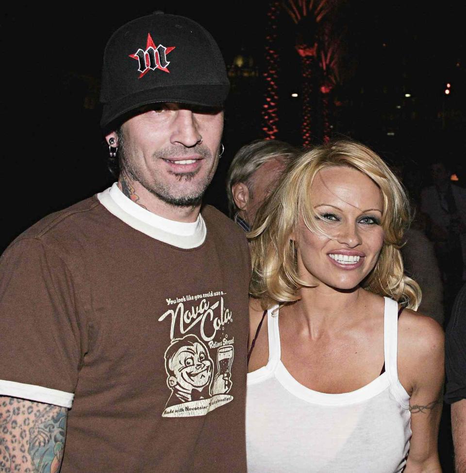 Pamela Anderson and Tommy Lee arrive at the Rodeo Drive Walk of Style Event Honoring Tom Ford on March 28, 2004 in Beverly Hills, California
