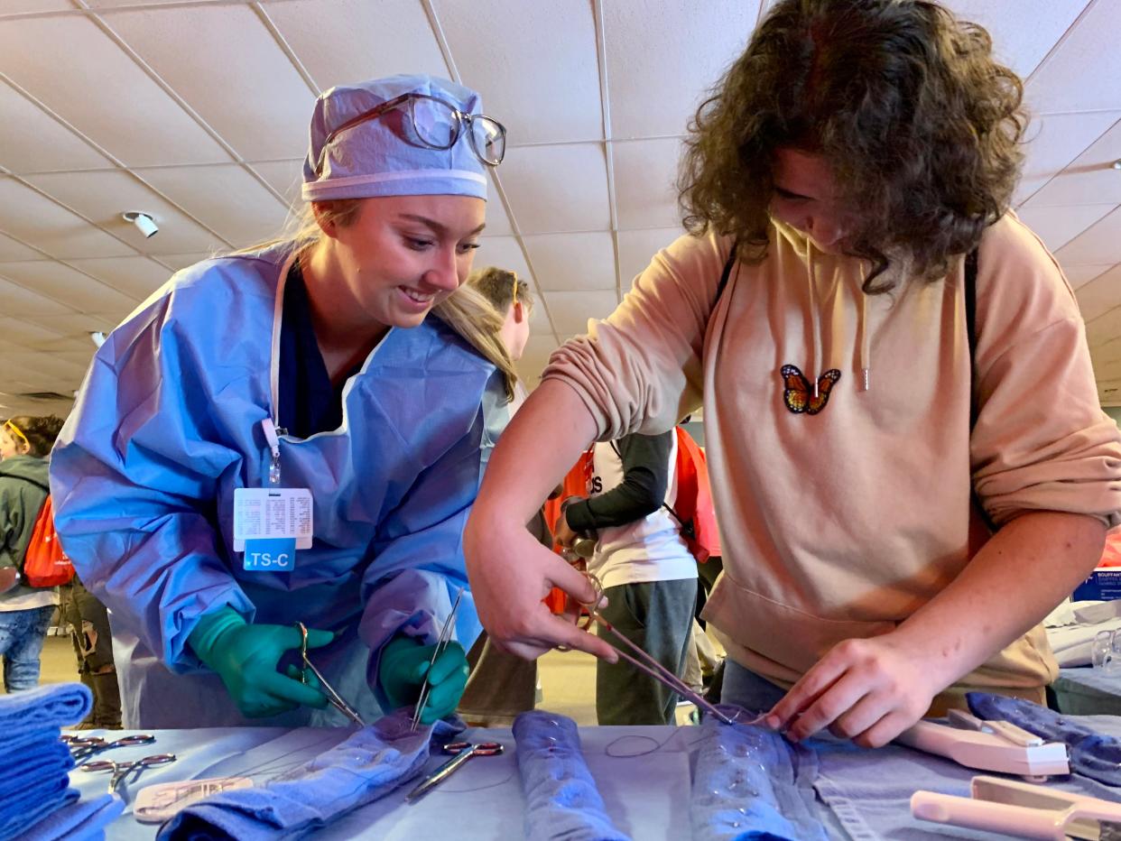 At MiCareerQuest, a career expo event by Michigan Works, students learned about a number of high demand jobs, including how to perform stitches with actual tools used in hospitals.