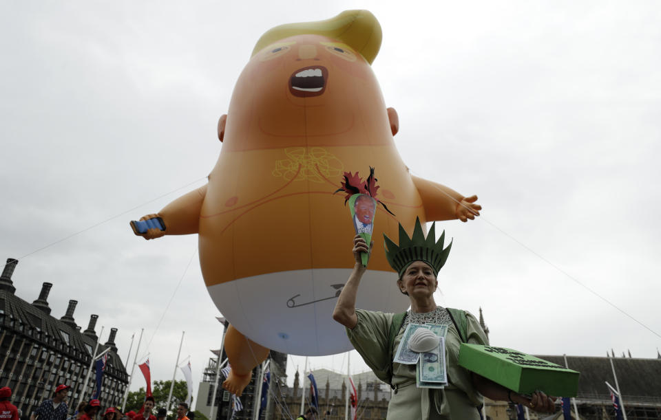 The "Statue of Liberty" near the "Trump Baby" blimp in central London. (Photo: Matt Dunham/AP)(Photo: Matt Dunham/AP)