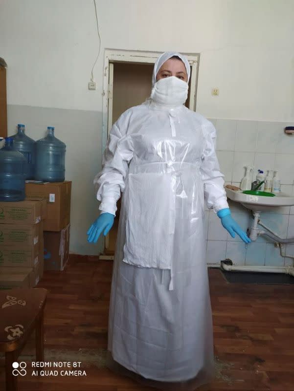 X-ray technician Aminat Medzhidova poses at a hospital in Dagestan