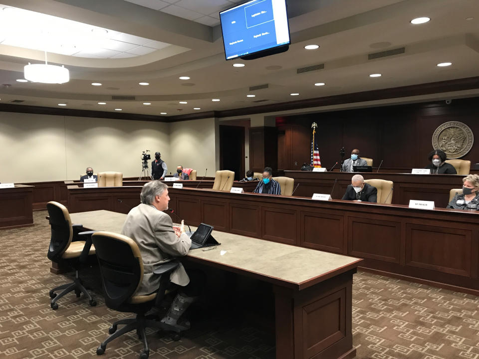 Rep. Mark Lowery speaks to members of the Legislative Black Caucus at the Arkansas state Capitol in Little Rock, Ark., Monday, Feb. 1, 2021, about his bill prohibiting schools from teaching the New York Times' 1619 Project. The bill is among several proposals in Republican states trying to limit how race and slavery is taught in public schools. (AP Photo/Andrew DeMillo)