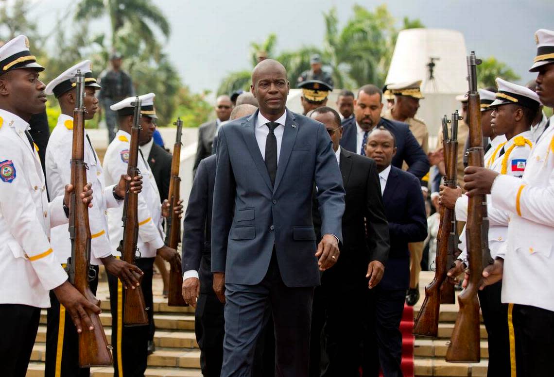 In this April 7, 2018, file photo, Haitian President Jovenel Moïse, center, leaves the  the National Pantheon Museum in Port-au-Prince, Haiti after a ceremony marking the 215th anniversary of the death of revolutionary hero Toussaint Louverture on April 7, 1803 in a French prison.