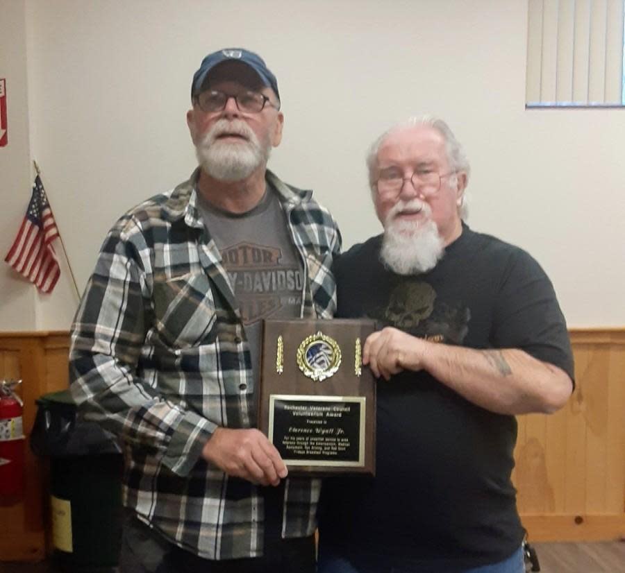 Veterans Council President Dennis Sellers (right) presents Clarence Wyatt Jr. (left) the Volunteerism Award at a recent Veterans Council meeting.