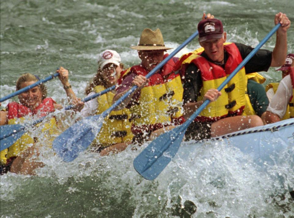 See, presidents<em> are</em> just like us! The Clintons took the quintessential American vacation shot of the 1990s while white-water rafting on the Big Kahuna Rapids of the Wyoming's Snake River in 1996. 