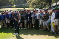 Scottie Scheffler chips out of the trees on the 17th hole during the final round at the Masters golf tournament on Sunday, April 10, 2022, in Augusta, Ga. (AP Photo/Robert F. Bukaty)