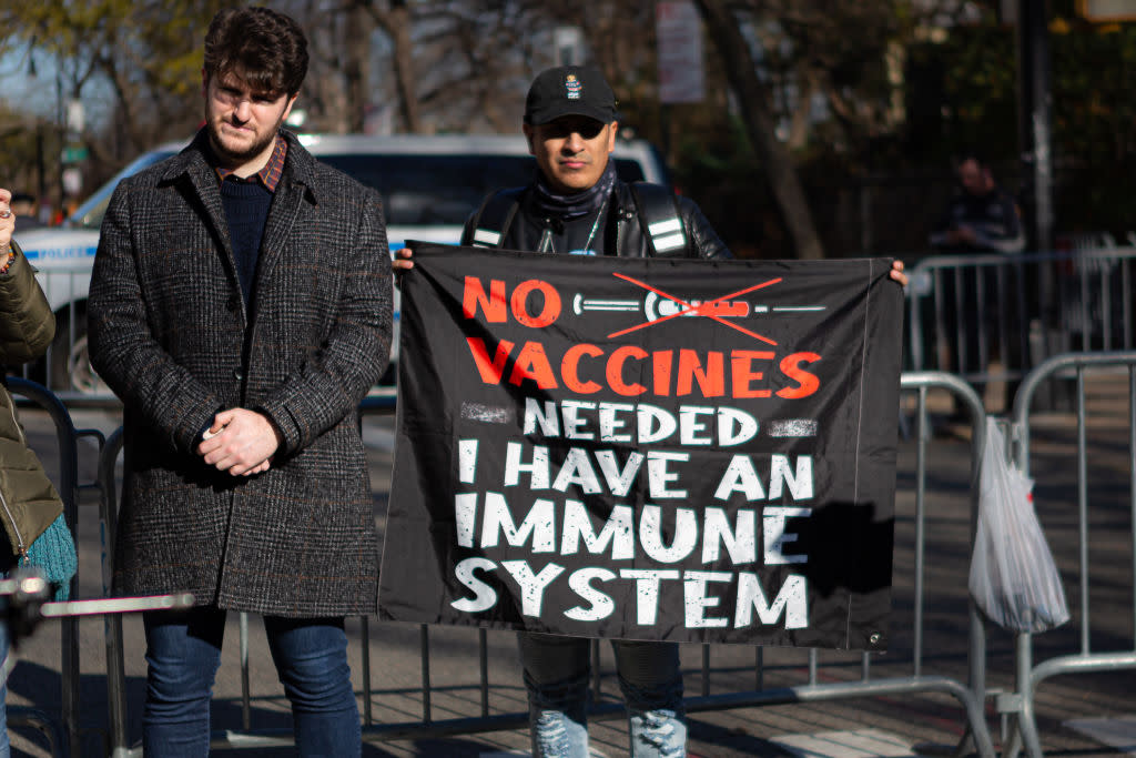 Dozens of antivax proponents rallied against a NYC mandate requiring all private-sector workers to show proof of two vaccine doses. The vaccine expansion is set to take place on December 27, just days before Mayor Bill de Blasio leaves office. (Michael Nigro/Pacific Press/LightRocket via Getty Images)