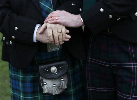 Larry Lamont and Jerry Slater (R) take part in a symbolic same-sex marriage outside the Scottish Parliament in Edinburgh, Scotland February 4, 2014. REUTERS/Russell Cheyne