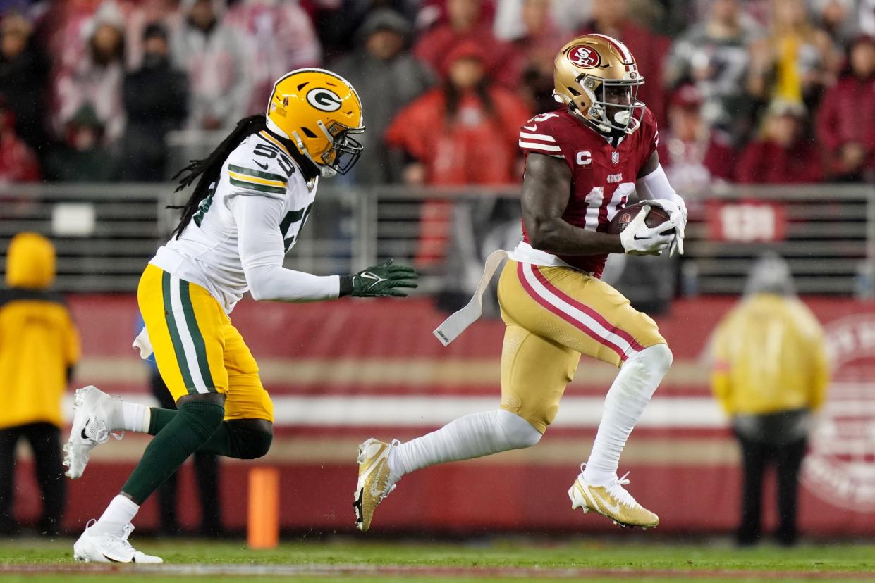 San Francisco 49ers receiver Deebo Samuel runs against Green Bay Packers linebacker De'Vondre Campbell during the first quarter in an NFC divisional round game at Levi's Stadium, Jan. 20, 2024 in Santa Clara, Calif.